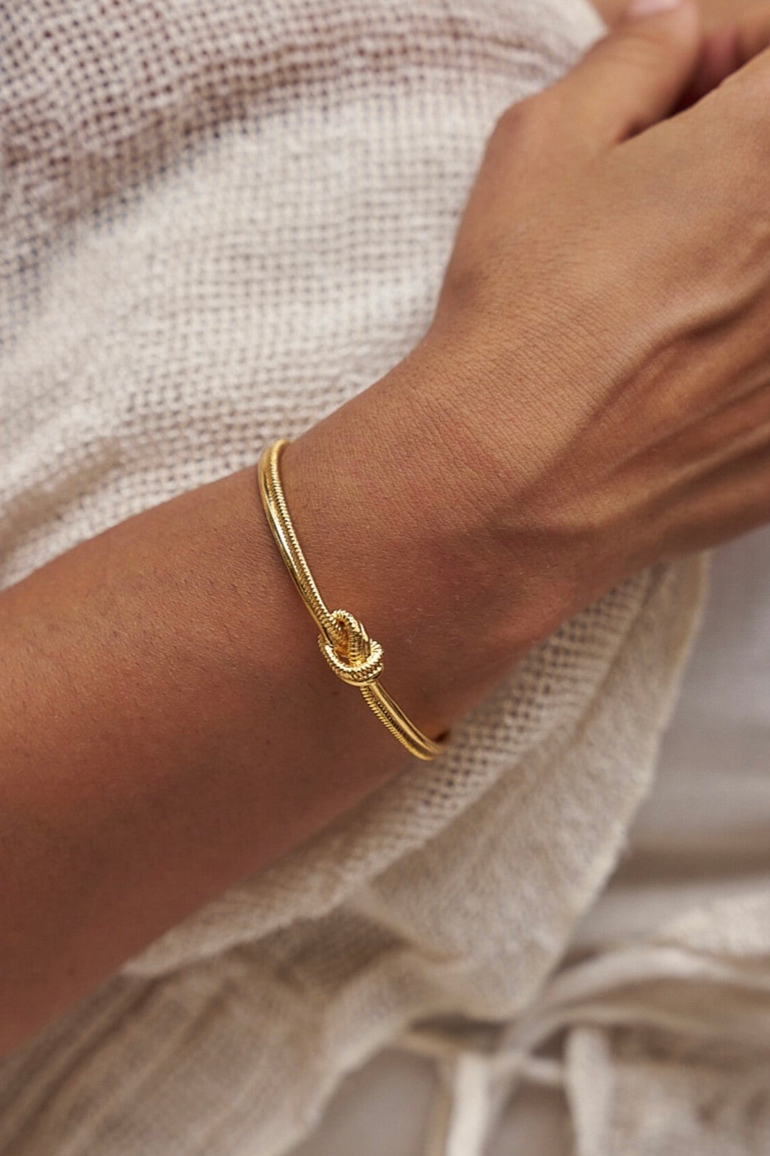 Lover's knot brass bangle- gold plated