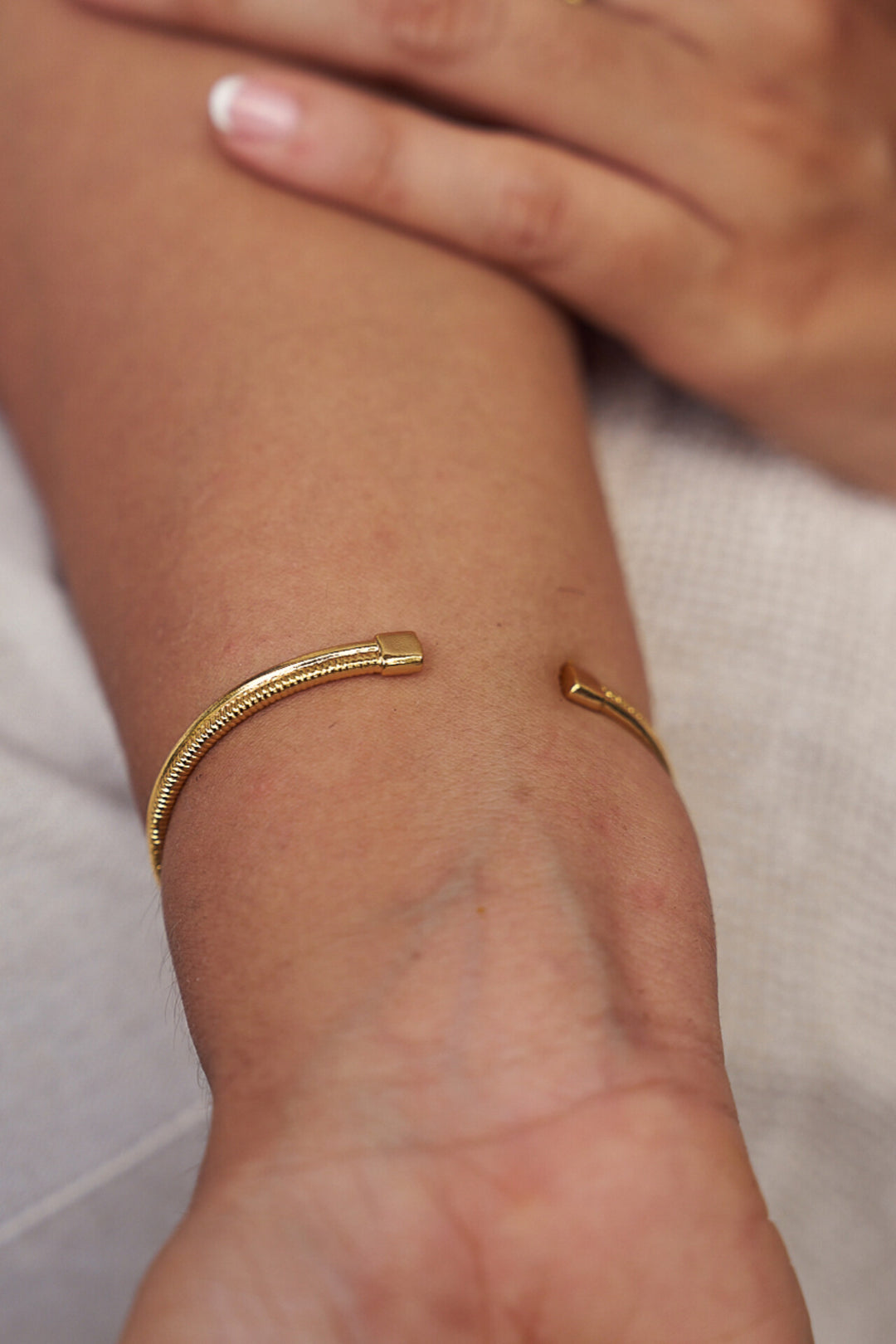 Lover's knot brass bangle- gold plated