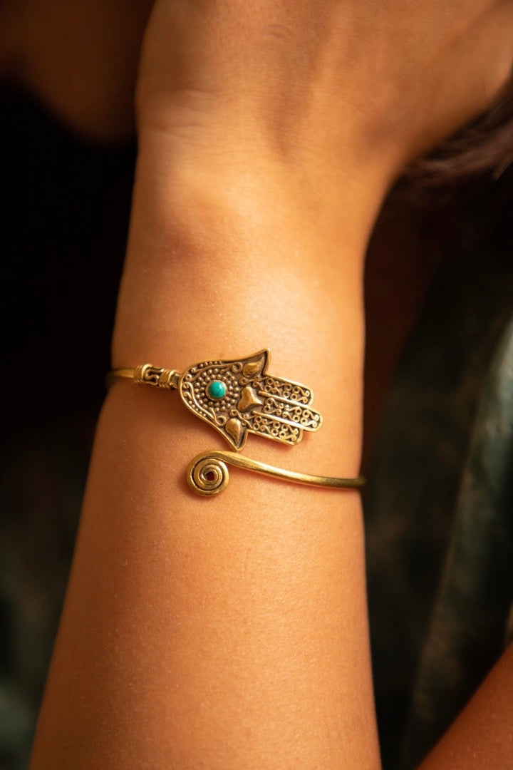 Hamsa brass hand cuff with turquoise stone