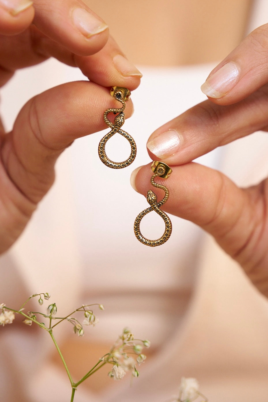 Tribal snake stud brass earrings.
