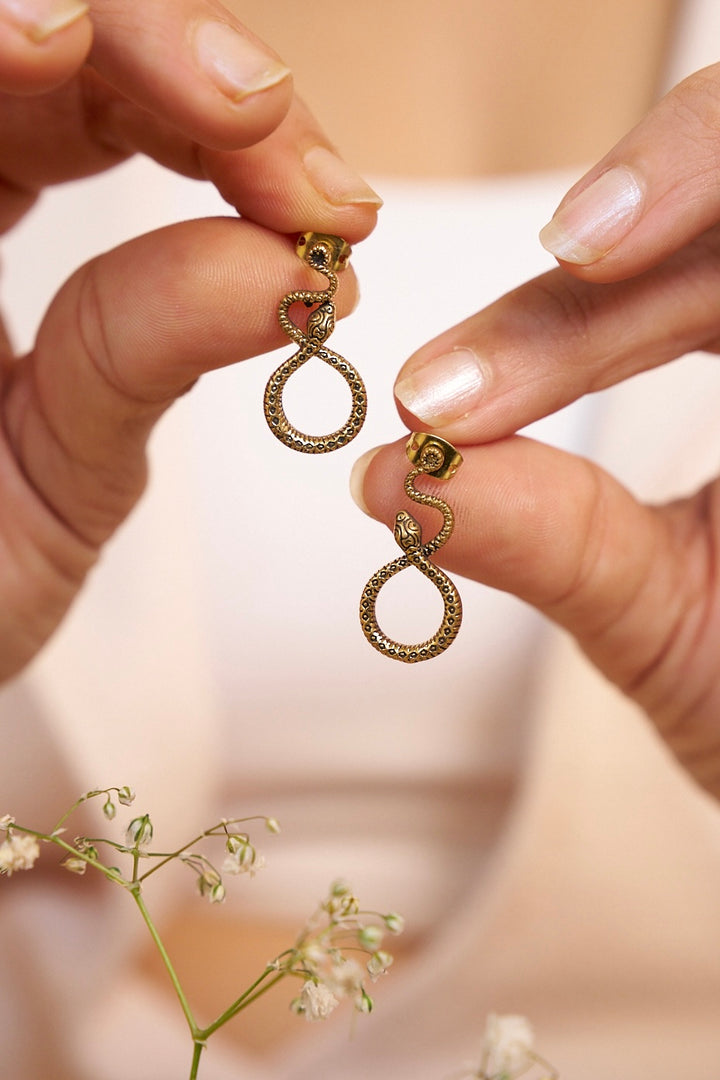 Tribal snake stud brass earrings.