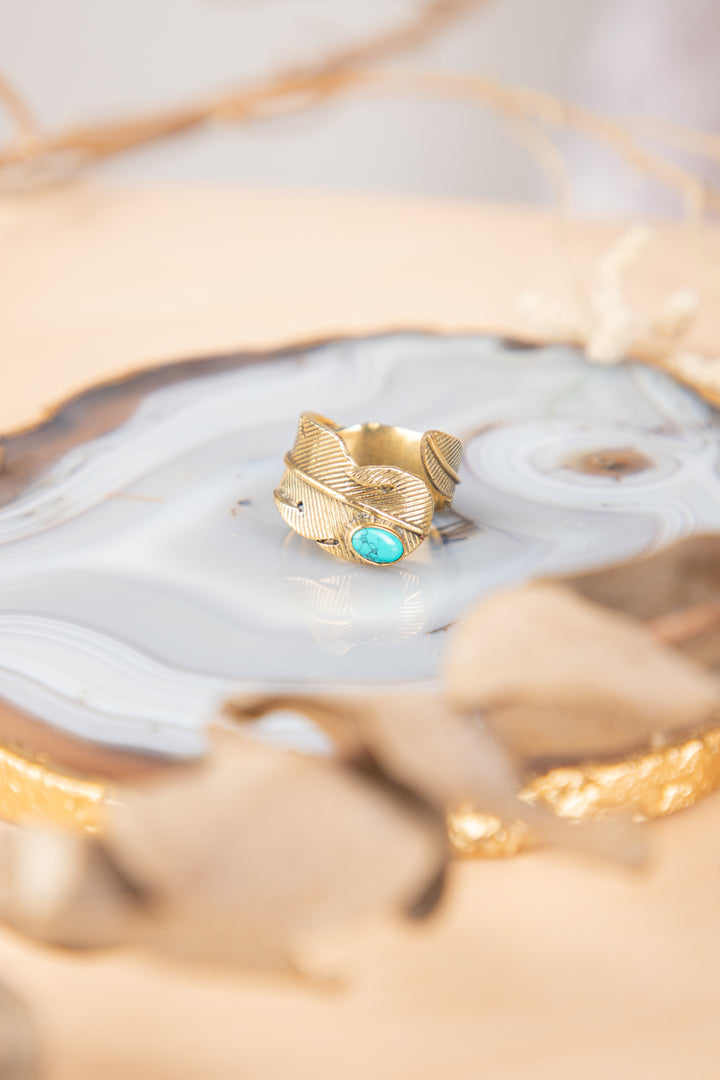 Turquoise feather adjustable brass ring. Size 5-8