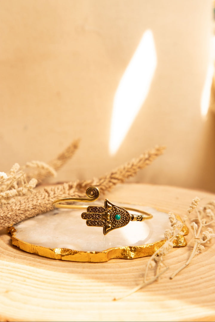 Hamsa brass hand cuff with turquoise stone