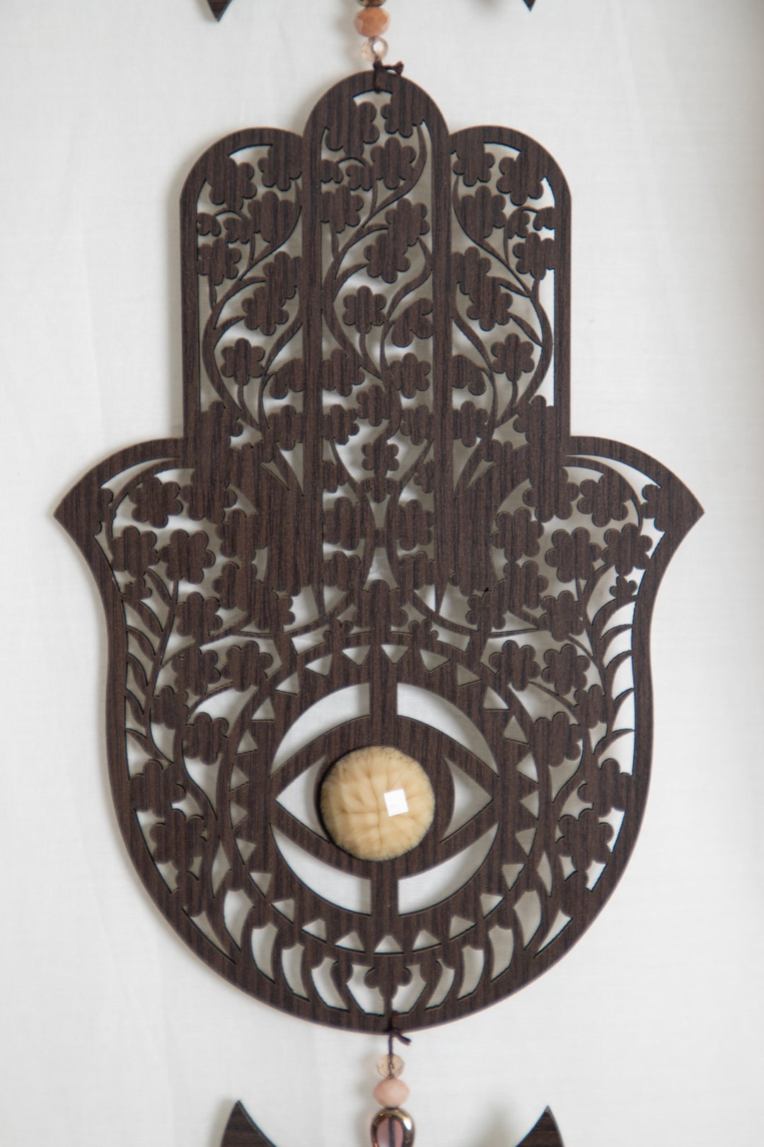 Hamsa wooden tassel hanging.