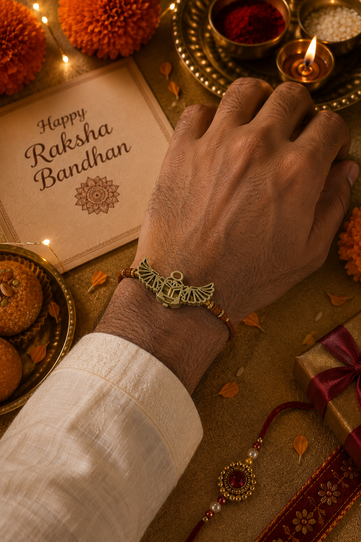 Mystic beatle brass rakhi cum Button holder with rice, haldi & kum kum dibbi gift pack.