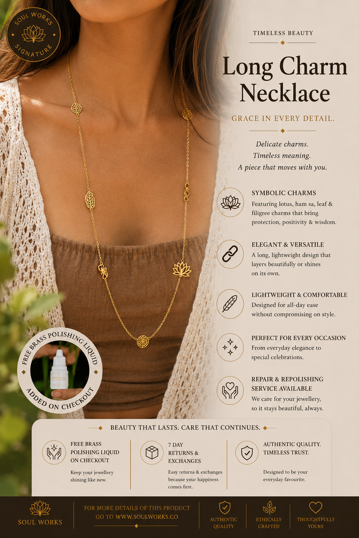 Long gold spiritual necklace with delicate symbolic charms including a lotus, hamsa, and sacred motifs, styled elegantly on the neckline with a minimalist bohemian jewellery aesthetic.