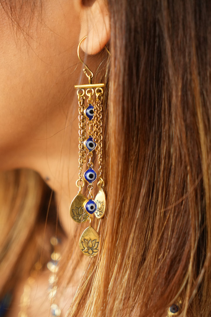Evil eye dancing brass droplets