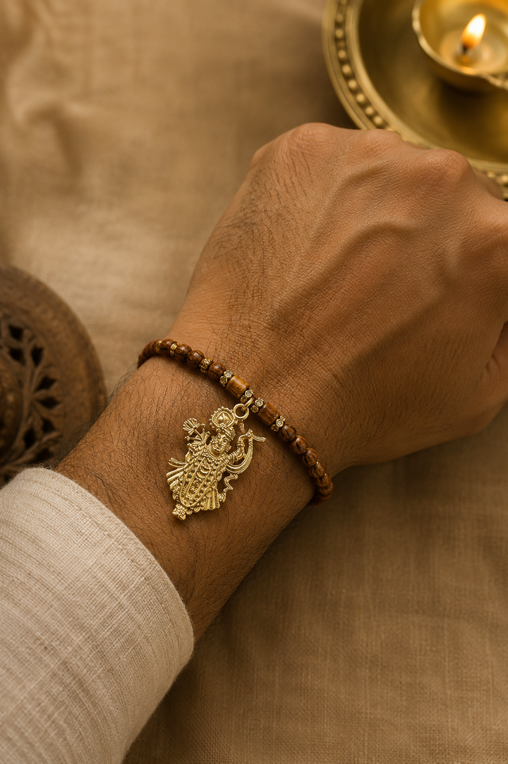 Shreenathji gold plated brass Rakhi with rice, haldi & kum kum dibbi gift pack.