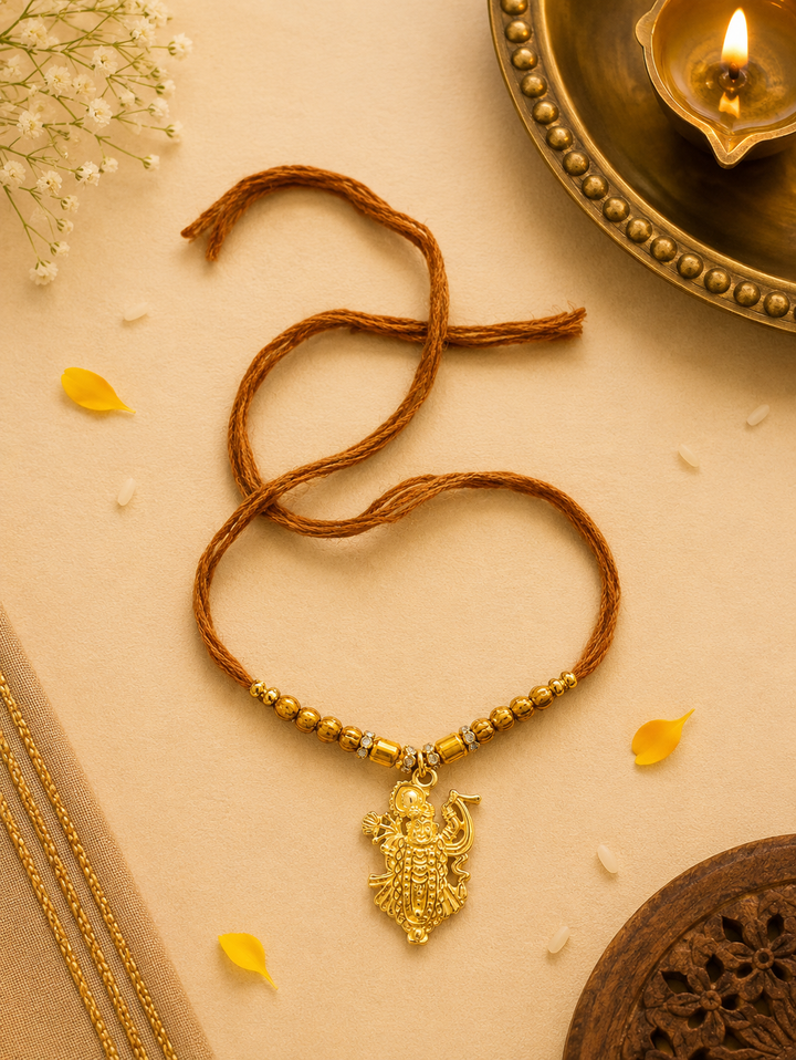 Shreenathji gold plated brass Rakhi with rice, haldi & kum kum dibbi gift pack.