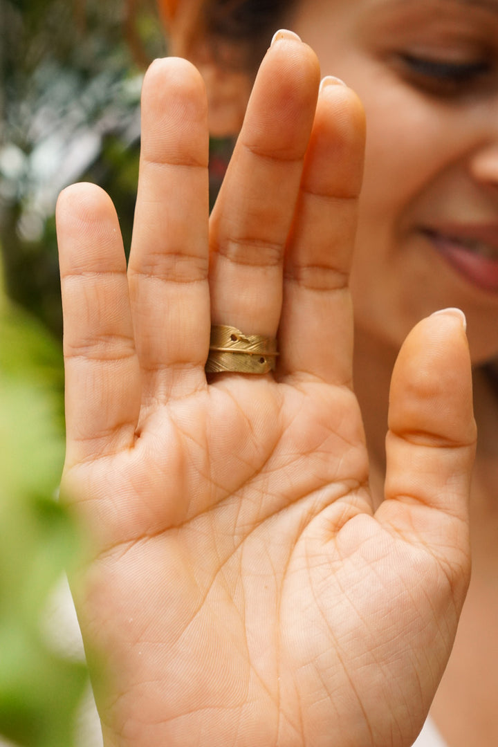 Turquoise feather adjustable brass ring. Size 5-8
