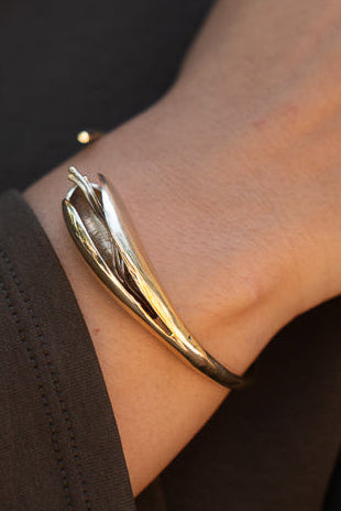 Floating pod brass bangle gold plated