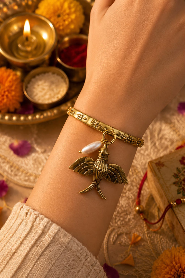 Bye bye birdie brass Lumba Rakhi With Rice, Haldi & Kum Kum Dibbi gift pack