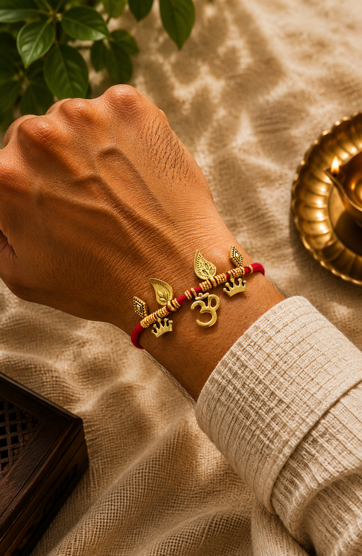 Om dangler rakhi with rice, haldi & kum kum dibbi gift pack.