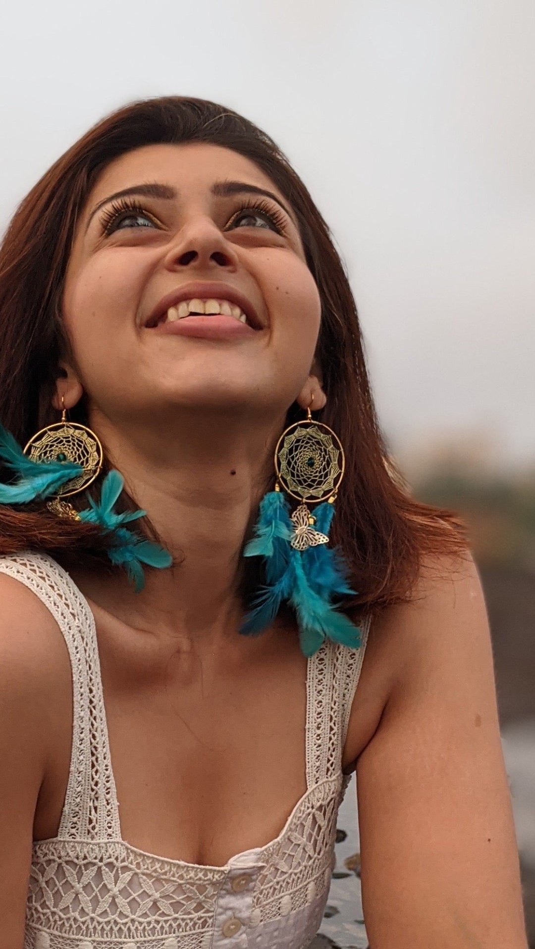 Dreamcatcher teal earring