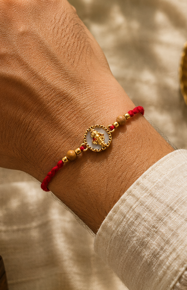 Ganesh mukh rakhi with rice, haldi & kum kum dibbi gift pack