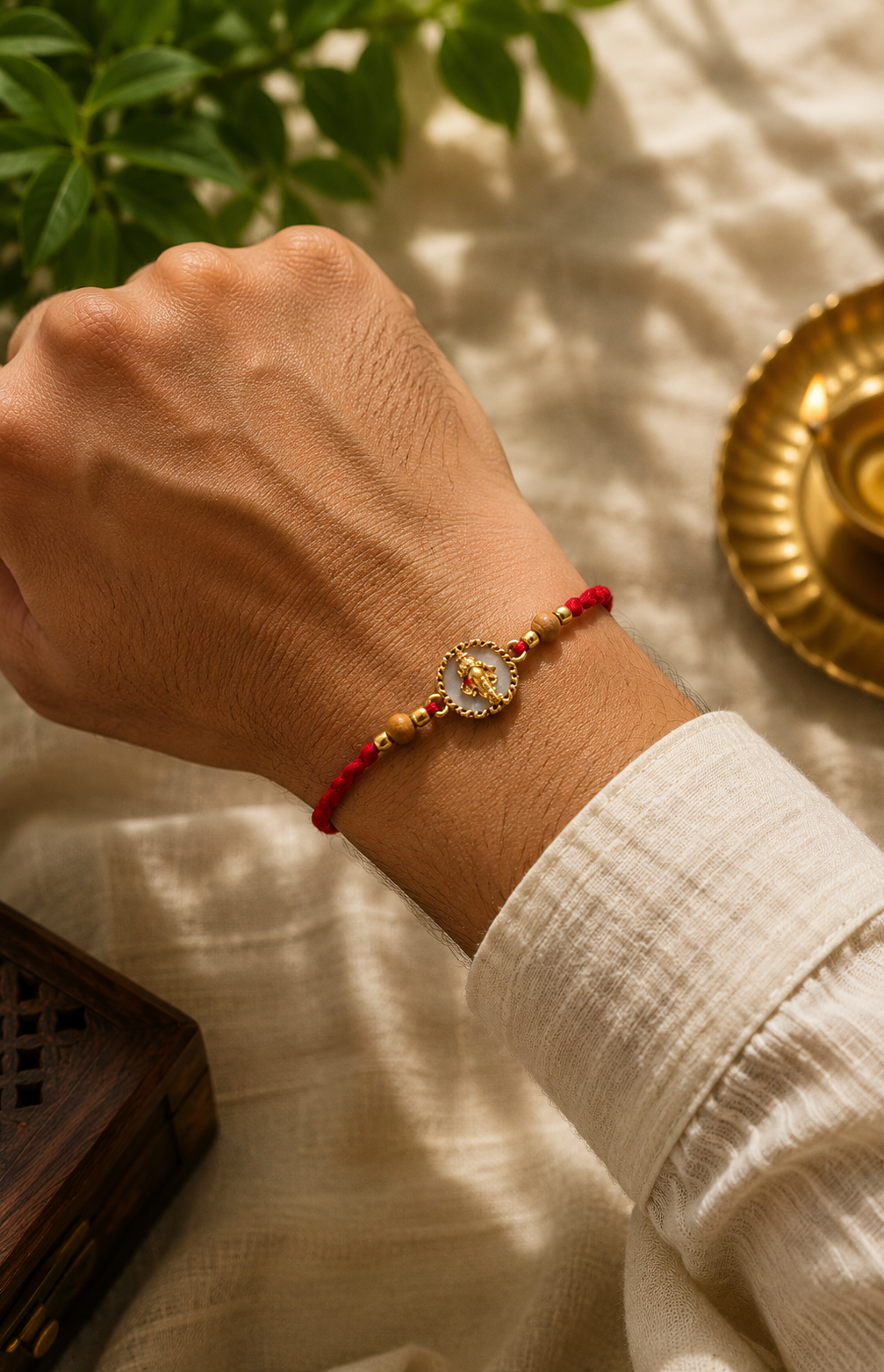 Ganesh mukh rakhi with rice, haldi & kum kum dibbi gift pack