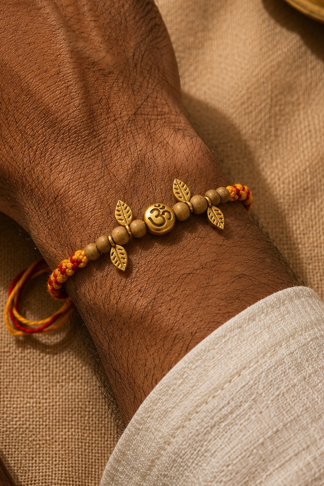 Om tassel Rakhi with rice, haldi & kum kum dibbi gift pack