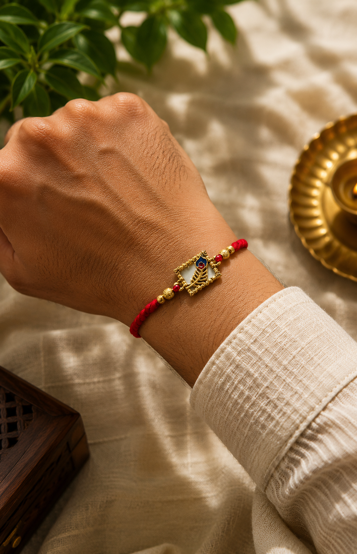 Mor pankh rakhi- mix alloy with rice, haldi & kum kum dibbi gift pack