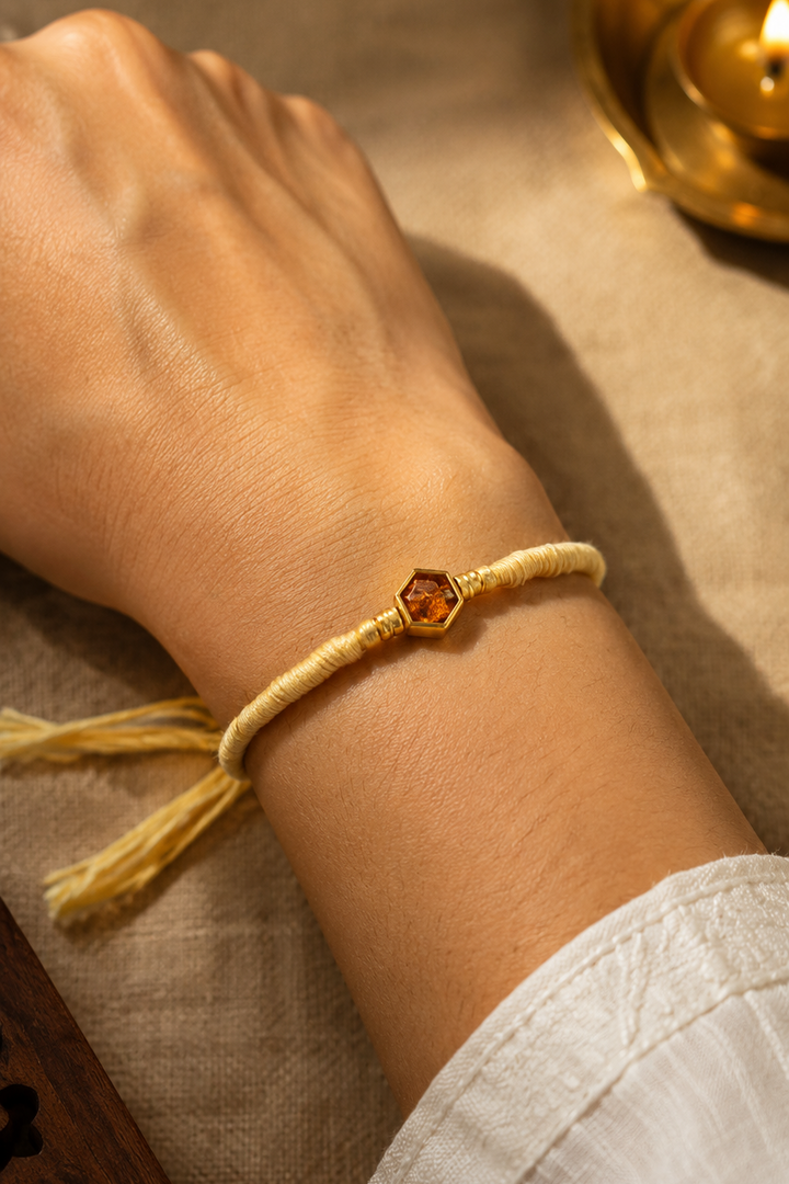 Raudra Rakhi in light brown thread with rice, haldi & kum kum dibbi gift pack